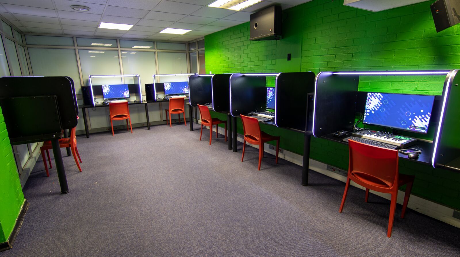 The green music production lab at PASMA, DAW workstations in rows