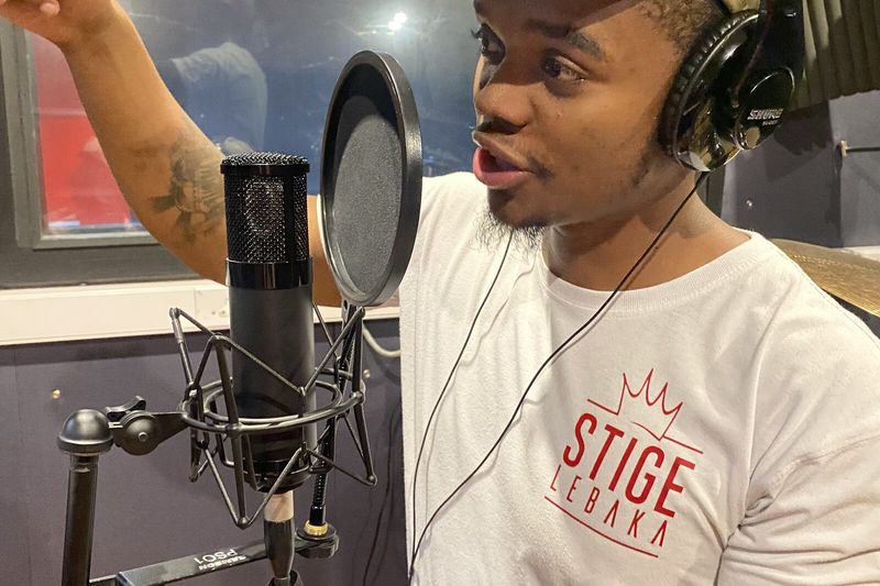 A PASMA student mid-take in the recording studio vocal booth
