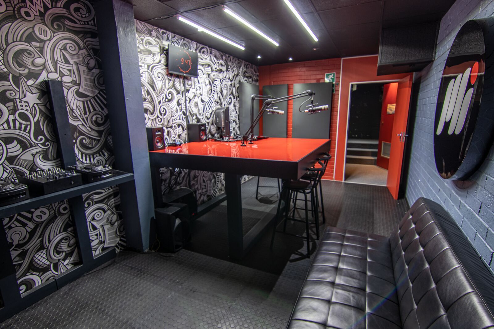 The red radio broadcast studio at PASMA, on-air desk and microphones