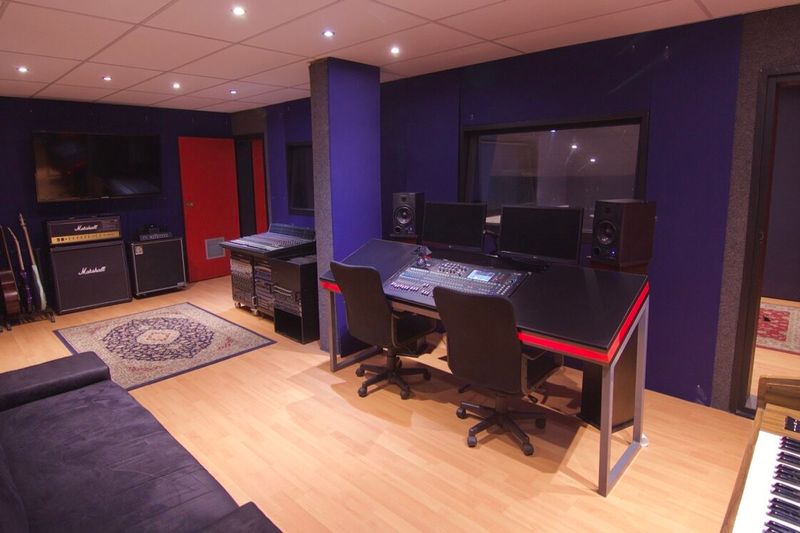 The recording studio control room at PASMA, mixing desk facing the live-room window