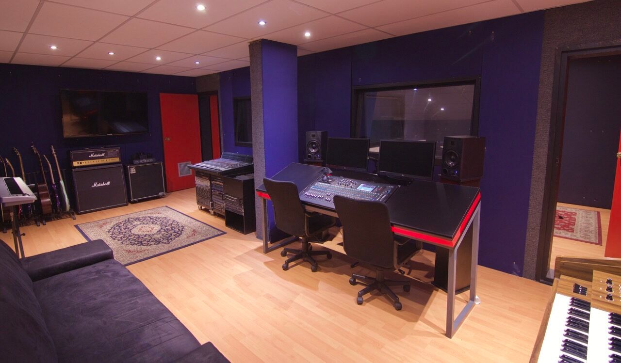 The recording studio control room at PASMA, mixing desk facing the live room window