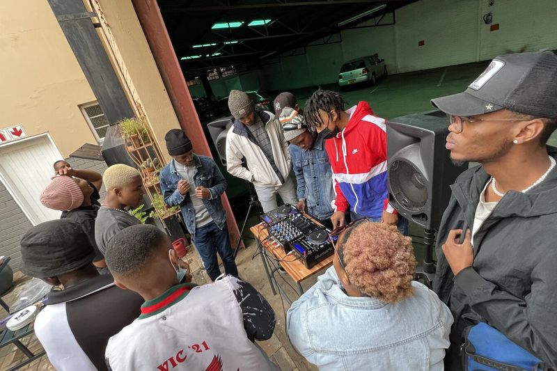 PASMA students laughing together outside the campus on West Burger Street