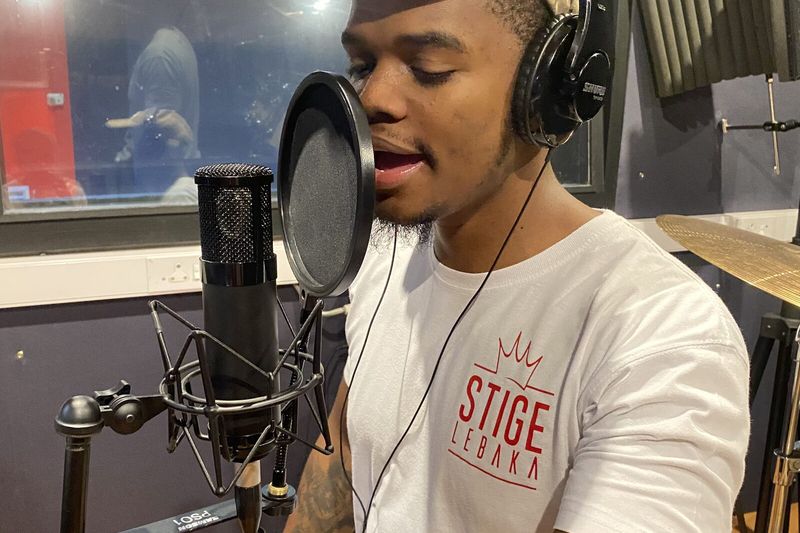 A PASMA student performing vocals behind the pop filter in the Studio B vocal booth
